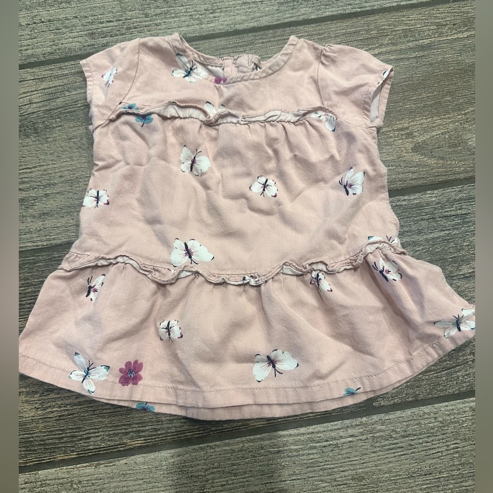 Baby girls Carter’s butterfly shirt in like new condition.